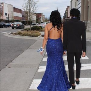 I’m selling this jovani prom dress .It’s royal blue and fitted with a long train